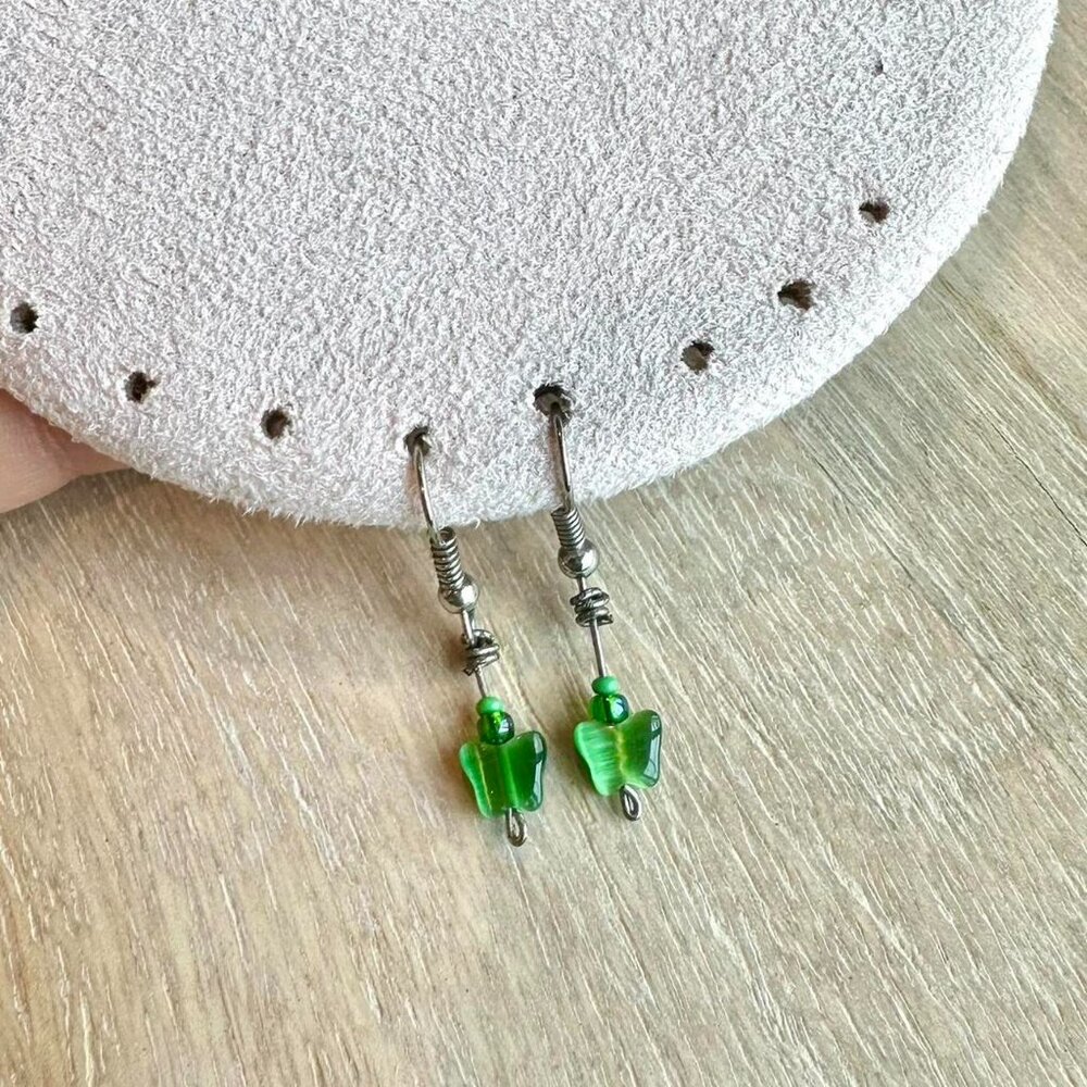 Green butterfly dangling silver earrings